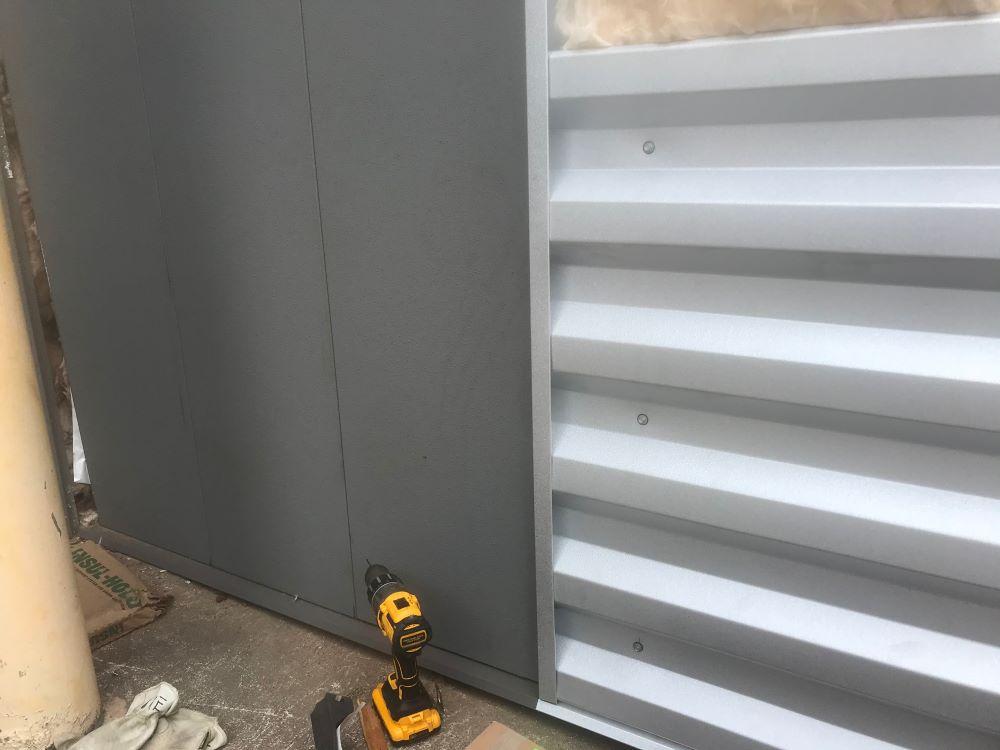 Metal wall panel with hidden fasteners