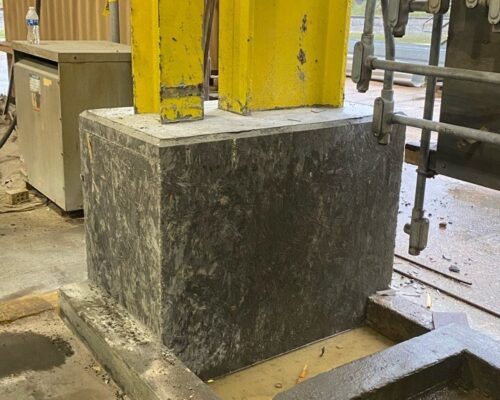Structural Repairs Concrete base installed around metal support column