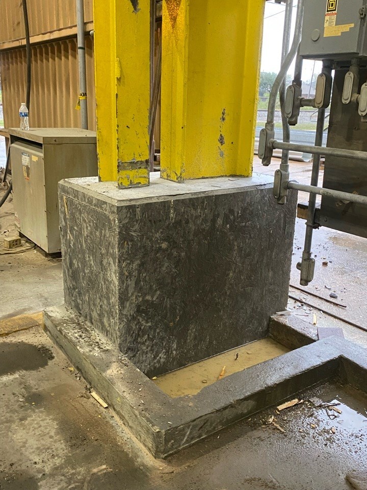 Structural Repairs Concrete base installed around metal support column